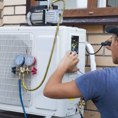 Professional AC Technician at Work - Texas HVAC maintenance - South Coast AC